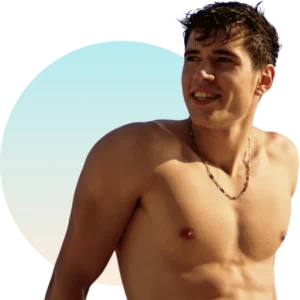 Tanned topless man with dark, wet hair looking over his shoulder and smiling.