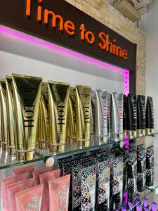 Australian Gold HOT tanning lotions on display shelf in The Tanning Shop UK store