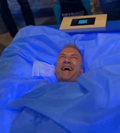 cryoblog Cryotherapy blog - man laughing in Zerobody dry float cryotherapy bed with blue light treatment at The Tanning Shop UK