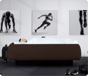 Man lying in a Zerobody dry floatation cryotherapy bed for post-workout muscle recovery at The Tanning Shop