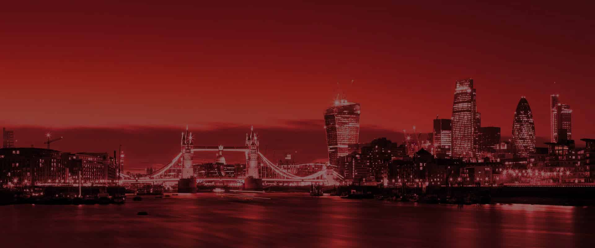 Red Light Therapy London Tower Bridge Skyline The Tanning Shop London skyline at night featuring Tower Bridge, representing The Tanning Shop's red light therapy services across London