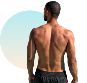 Tanned man with a deep, even UV tan showing professional tanning results from The Tanning Shop UK
