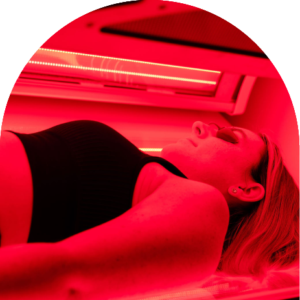 Close-up of a Tanning Shop customer using a full-bed red light therapy bed in a UK salon.