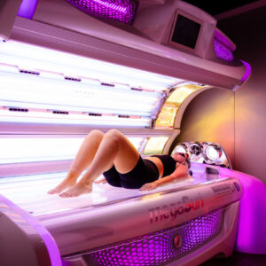Customer on a lay-down sunbed following a WellFit skincare treatment at The Tanning Shop Customer on a lay-down sunbed following a WellFit skincare treatment at The Tanning Shop