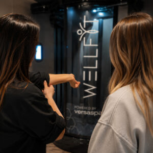 Customer receiving a WellFit skincare consultation at The Tanning Shop Customer receiving a WellFit skincare consultation at The Tanning Shop